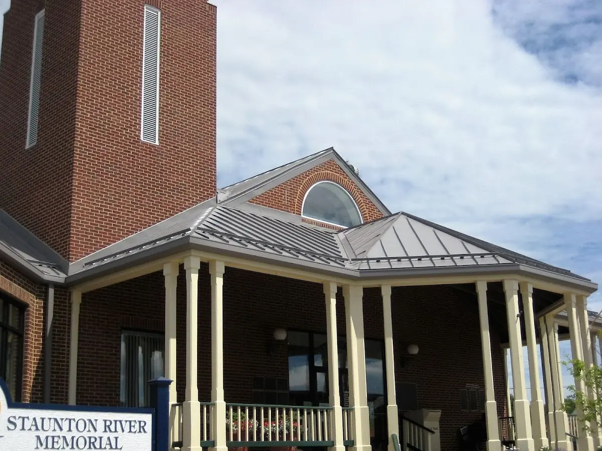 Skilled roofing craftsmen working on a residential roof in Luray